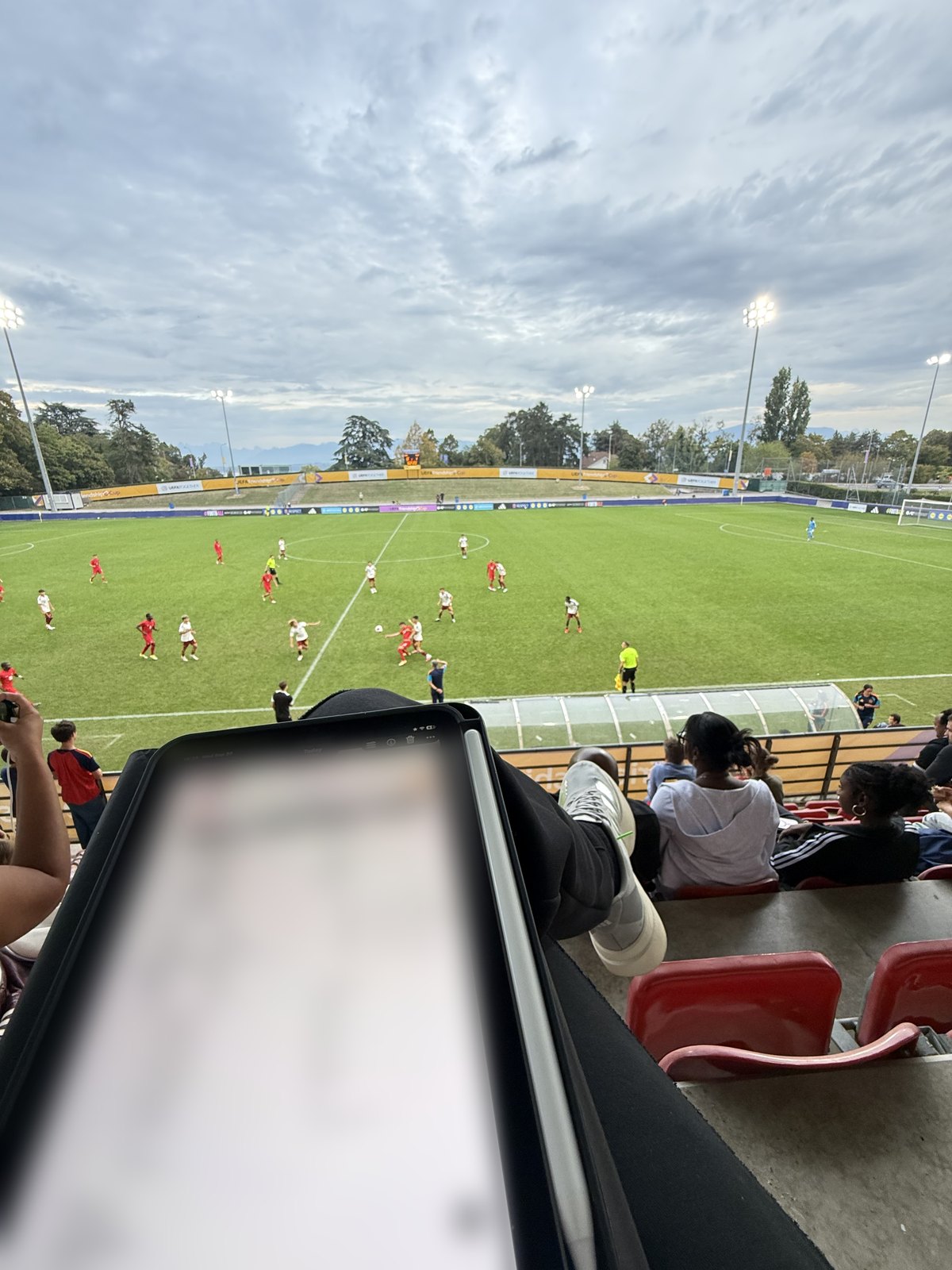 Team sheet on a tablet in the stands during a UEFA Friendship Cup match